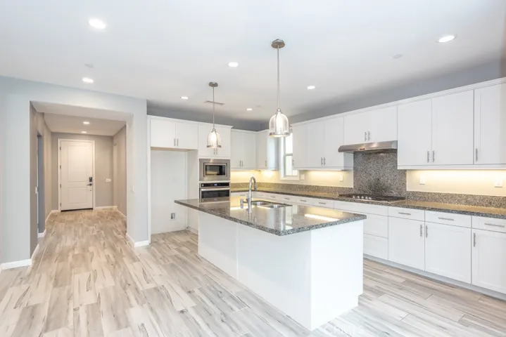 Kitchen, looking back towards entry; stairs on right cannot be seen from this photo