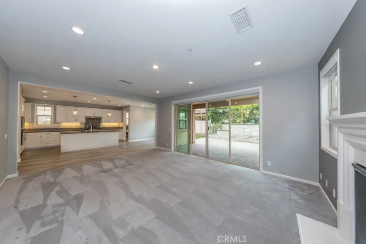 view from den towards kitchen and backyard.  Note double sliding glass doors to backyard!