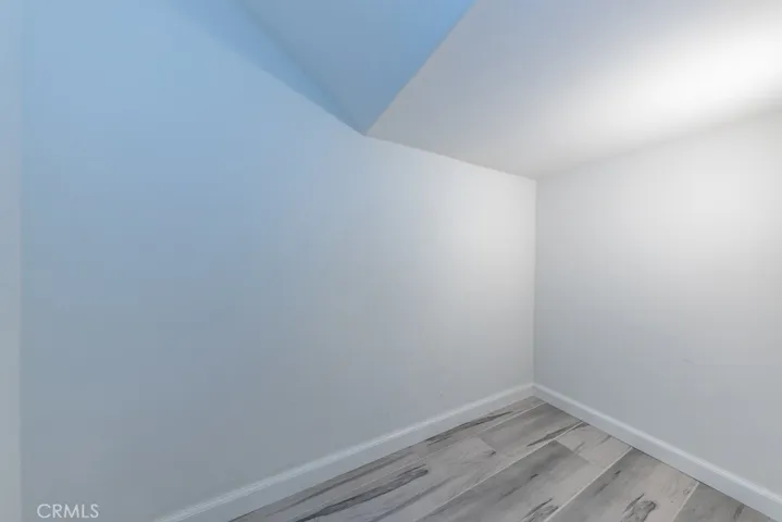 inside the lit storage area under staircase