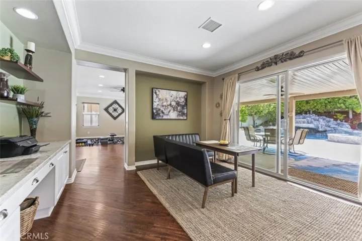 Family dining room leading to pool yard paradise