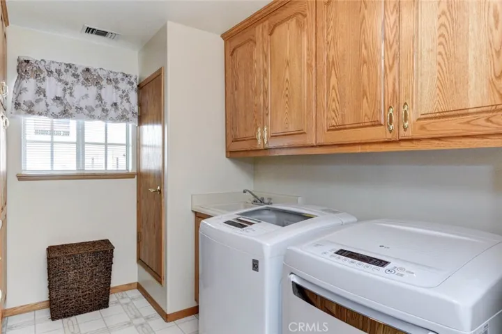 INSIDE WASHER AND DRYER AND ANOTHER 3/4 BATHROOM