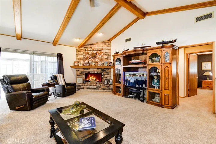 HUGE FAMILY ROOM WITH OAK BEAMED CEILING AND WARM FIREPLACE