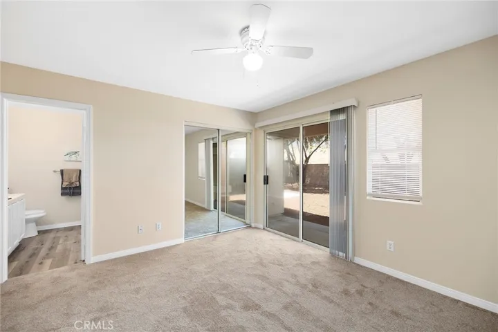 Primary bedroom with access to covered patio