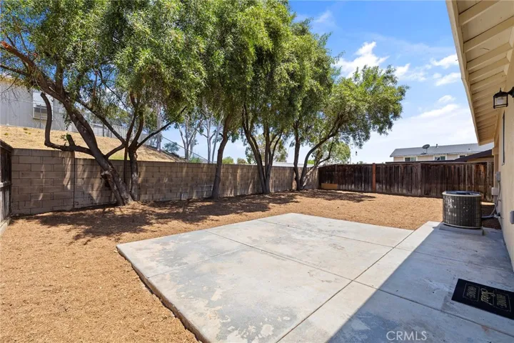 Rear yard with 2 concrete patios