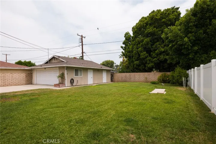 Rear yard with detached garage and workshop