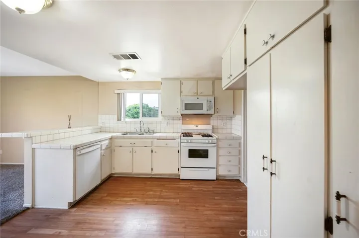 3 bed, 2.5 bath end unit, open floorplan, garage, pool, near top schools.