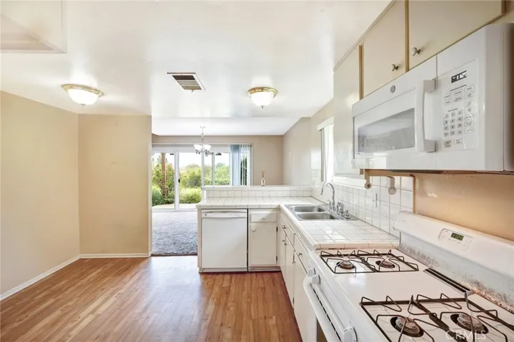 3 bed, 2.5 bath end unit, open floorplan, garage, pool, near top schools.
