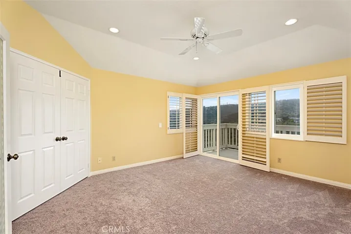 Primary bedroom suite with panoramic canyon and peekaboo ocean view.