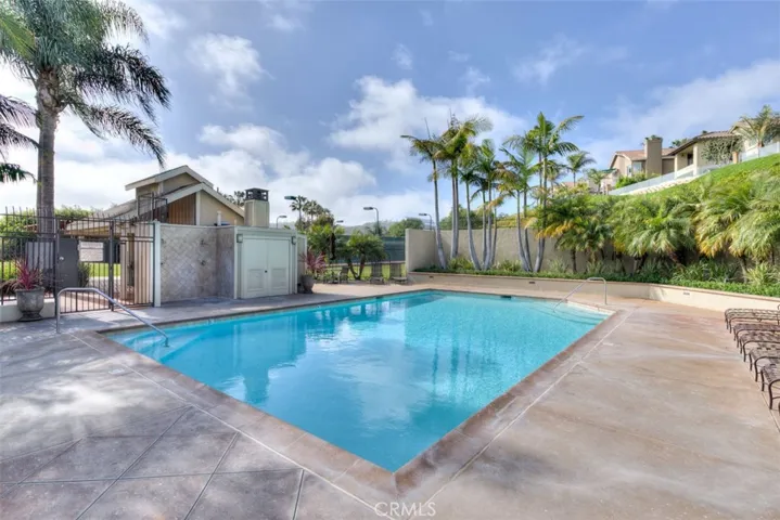 Community pool with showers, restrooms, picnic, and covered eating area.