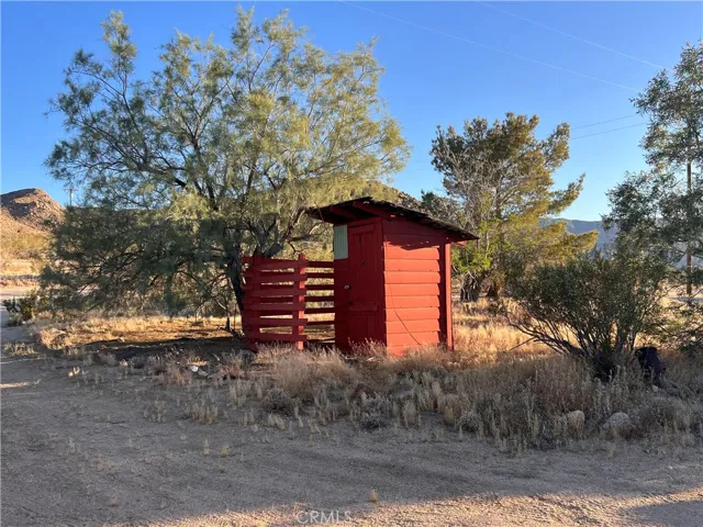 The old outhouse from the days when the home was a small cabin