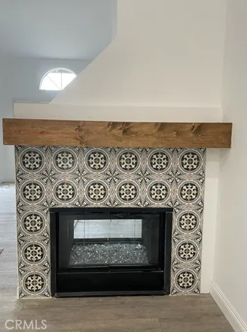 Double-sided gas fireplace with fire glass.