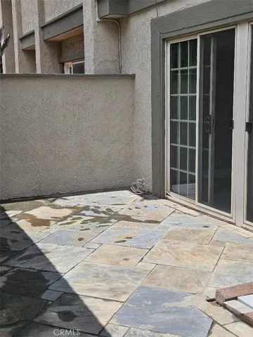 Gated private courtyard between home entry and garage