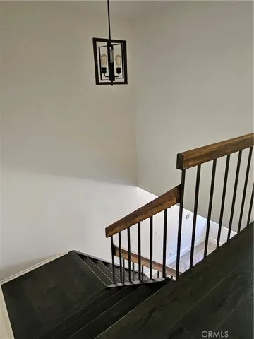 Pretty wood stairway with pretty hand rail