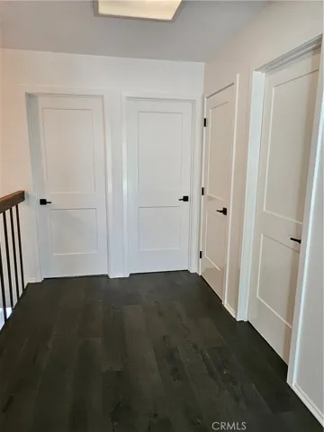 Upstairs with hardwood flooring and Updated interior doors and hardware throughout