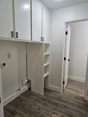 Interior laundry room with plenty of cabinets