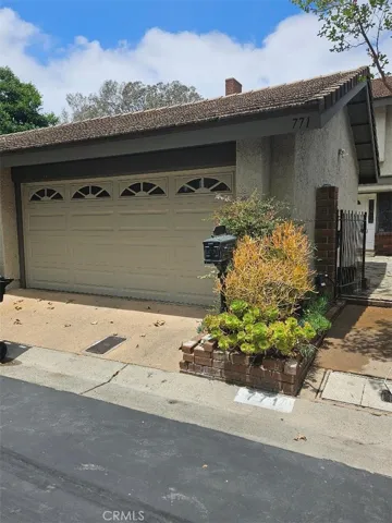 2 car garage with entry to private patio