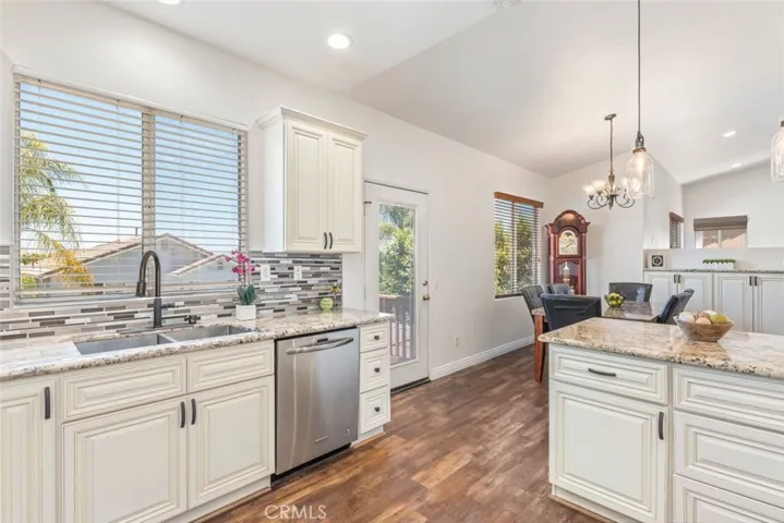 Cook and entertain in this beautifully upgraded kitchen with modern finishes and ample natural light.