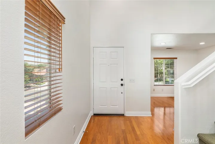 Enter into a bright and inviting foyer with ample natural light.