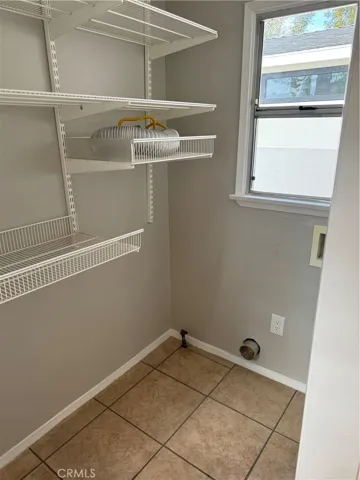 The laundry room/pantry is conveniently located next to the kitchen