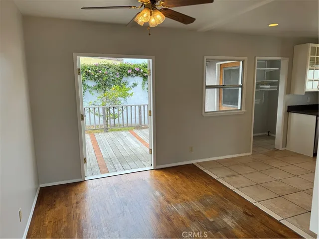The dining area extends through french doors to the deck and backyard, or turn right for the full-sized kitchen, and laundry room/pantry