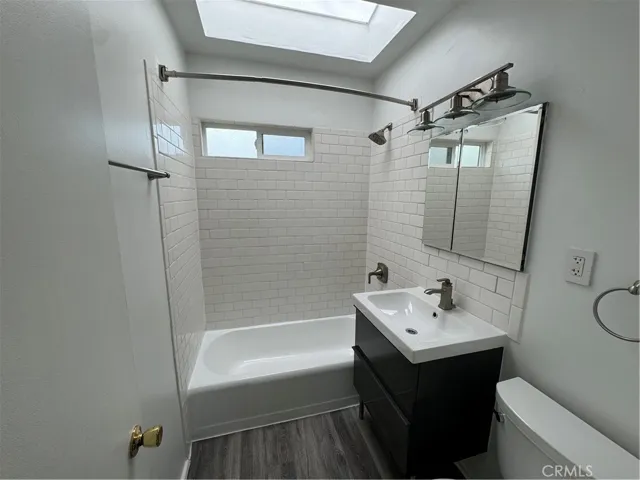 The bathroom is a sanctuary with a freshly glazed tub
