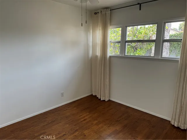 The 2nd bedroom looks out into the backyard.  It also has a ceiling fan