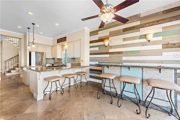 Kitchen open to bar area/family room.