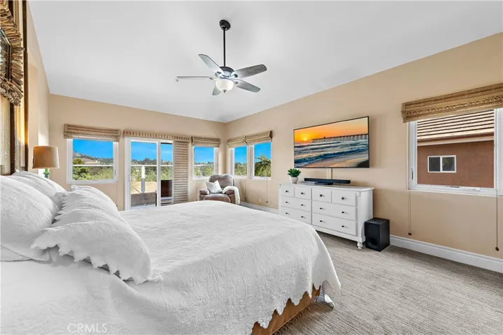 Primary bedroom with a balcony.