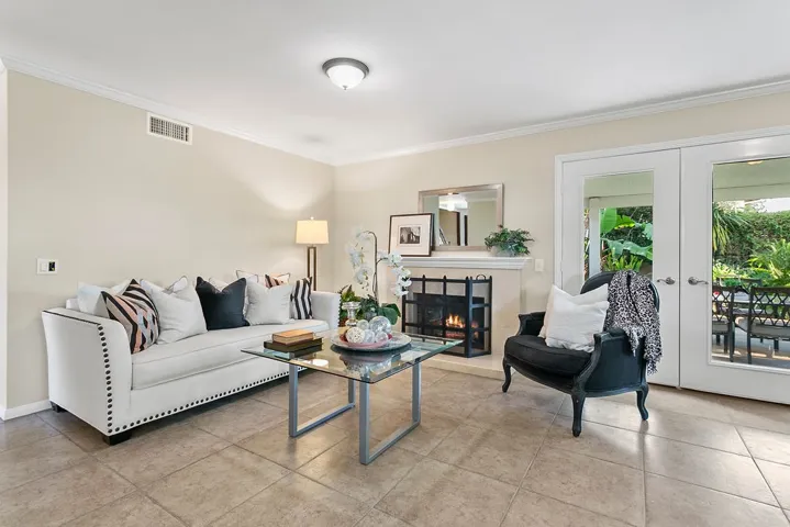 Featuring tile floors, fresh paint and crown moldings.