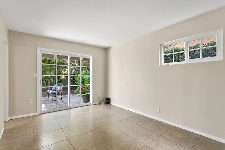 Primary bedroom with slider to front patio.