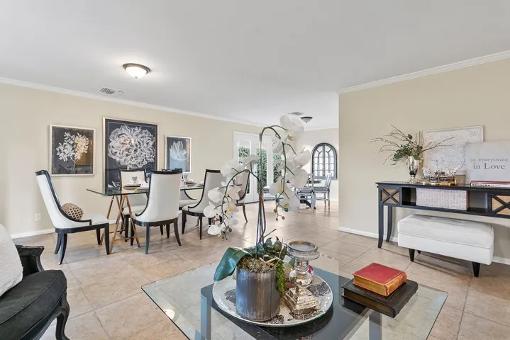 Open to the formal dining and kitchen dining area.