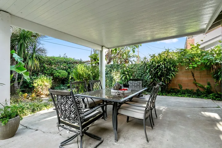 Covered patio in rear yard.