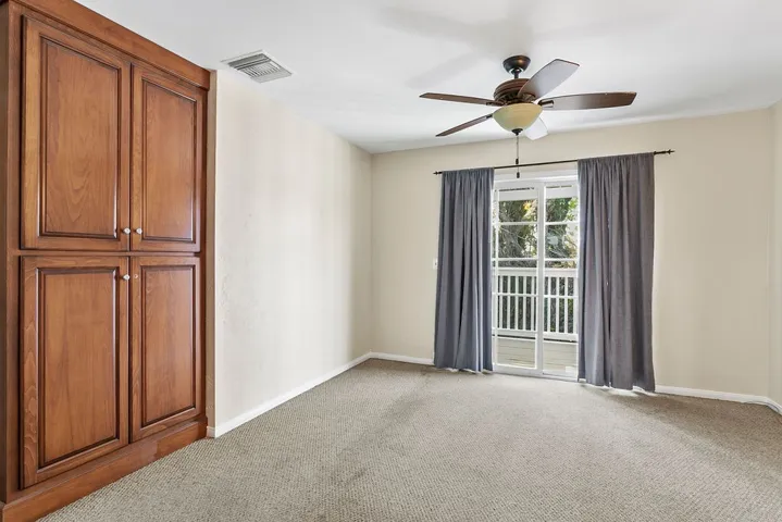 Upstairs apartment with living room with door to deck and separate entrance.