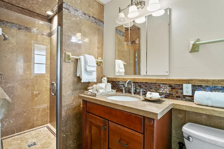 Primary bathroom with custom stone shower.