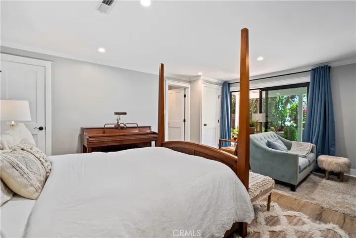 The lower level bedroom affords direct access to the backyard.