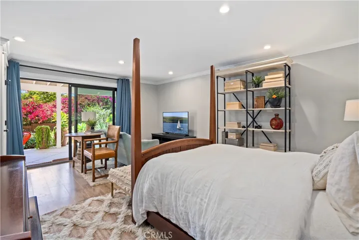 The lower level bedroom affords direct access to the backyard.