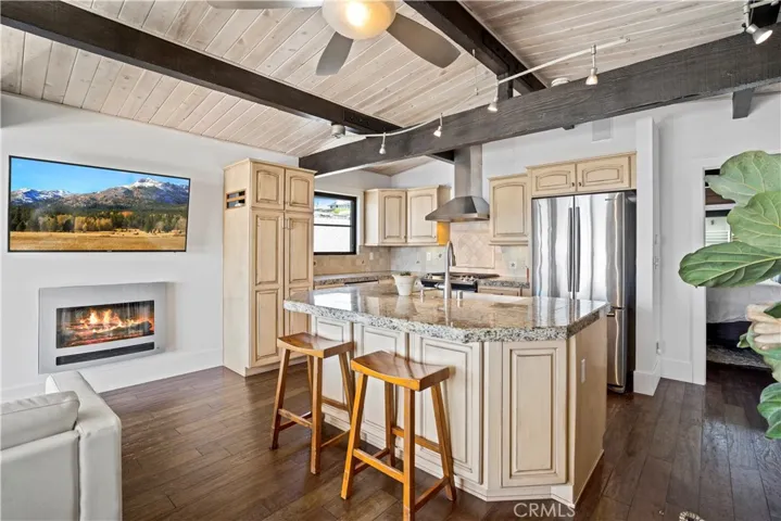 The open floor plan includes a living and dining room that accesses a large entertainer’s-dream deck which enjoys a breathtaking ocean views.