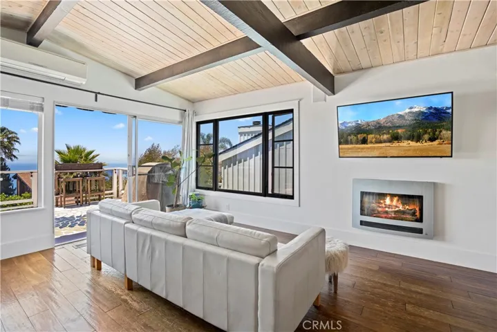 These spaces include exposed beamed ceilings and walls of glass that maximize endless views.