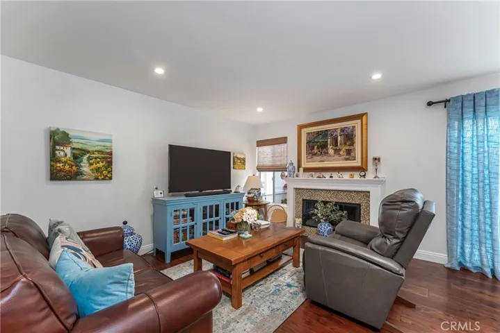 Living room with recessed lights and fireplace