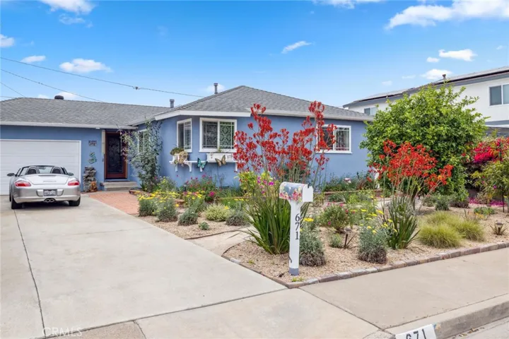 Stunning gardens, RV parking, and a large driveway accommodating up to six cars