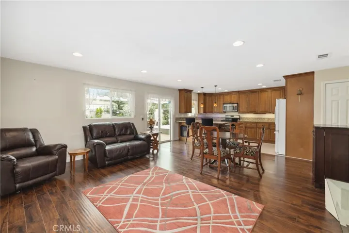 Versatile Open Layout:  Kitchen, dining, & living room with sliding door to deck