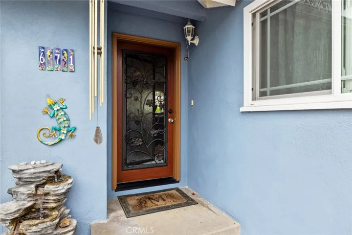 Custom front door with ventilated glass panel for enhanced air flow