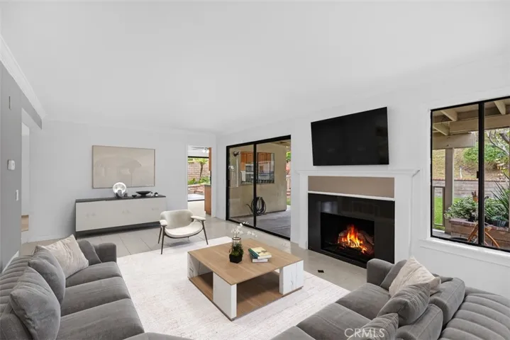 Enjoy your family time in this spacious family room with a fireplace & view of the backyard.
*photo is virtually staged.