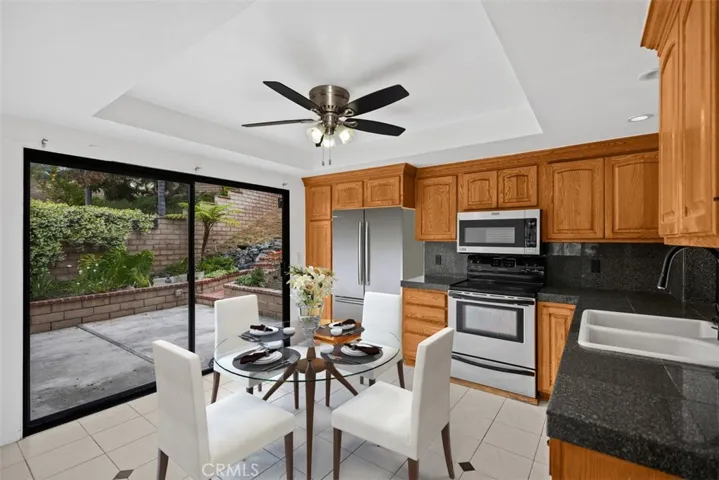 Beautiful kitchen with large slider to side patio.
*photo is virtually staged.