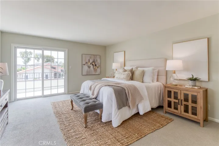 Primary suite with outdoor balcony, walk-in closet and primary attached bath...