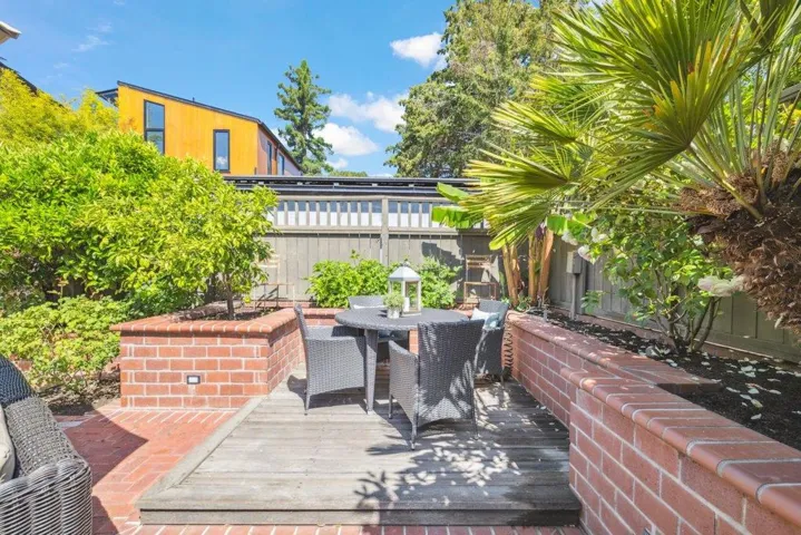 raised deck surrounded by planter box/sitting wall