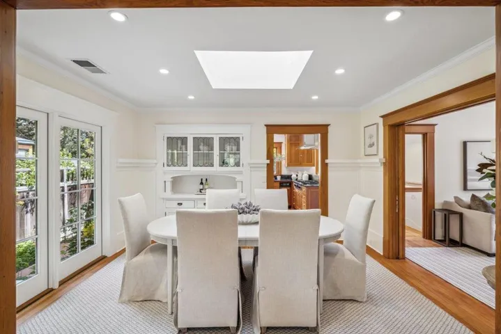 formal dining room with leaded glass hutch,French doors, skylight