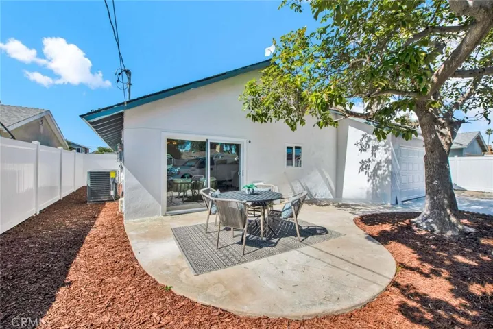 Extra Large Backyardwith white Vinyl Fencing, Wide Gated Driveway from the Alley that Offers a Rare Opportunity for RV or Boat Storage with Potential to Build an ADU with a Separate Access from the Main House!