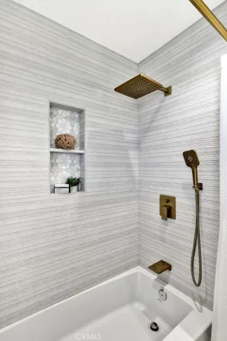 Completely Remolded Bathroom with Quartz Countertops.