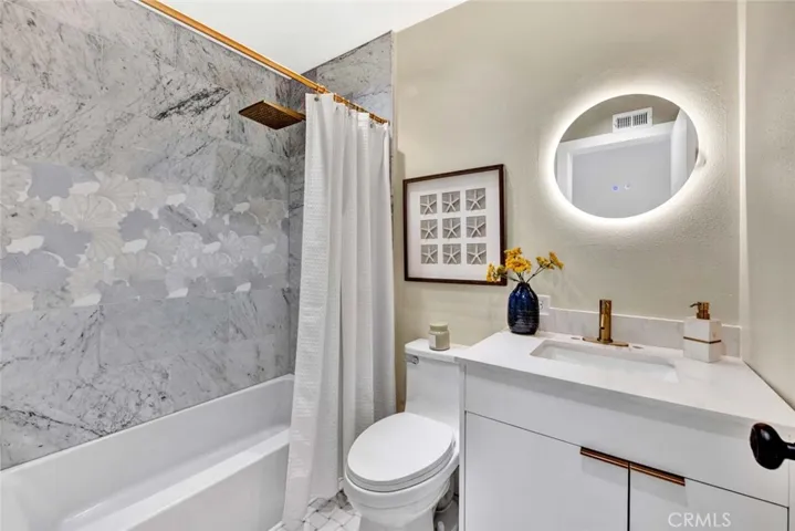 Completely Remolded Bathroom with Quartz Countertops.